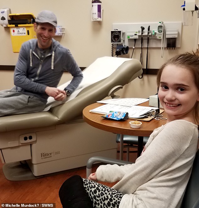 Treatment: Brian (pictured in hospital with daughter Madison, eight), from Chicago, Illinois, underwent immunotherapy and chemotherapy to tackle the illness
