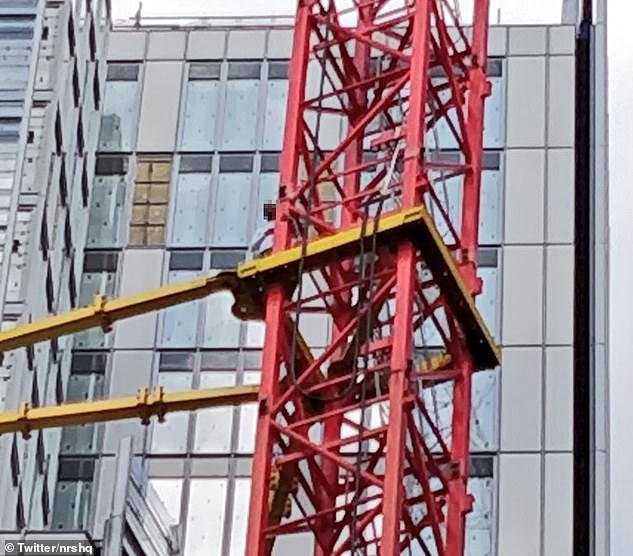 Police were called to the scene in St Thomas Street, south east London at 12.57pm today after the man climbed the crane, a Met Police spokesperson said