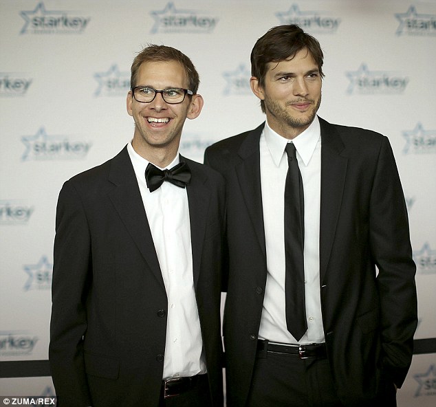 Happy news: Michael Kutcher - seen with his twin brother Ashton in 2013 - is reportedly expecting a child with his wife later this year