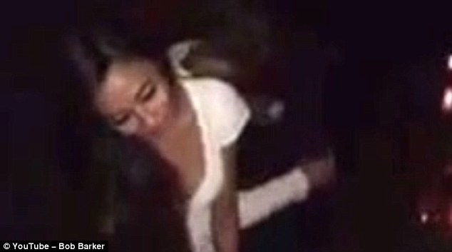 The footage shows a woman identified as Nina climbing off a man