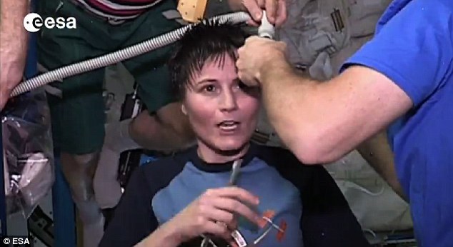 On board the ISS, several astronauts have had hair cuts, including Italian astronaut Samantha Cristoferetti (pictured). Using scissors, her crewmates cut her locks while a vacuum was used to suck up stray strands